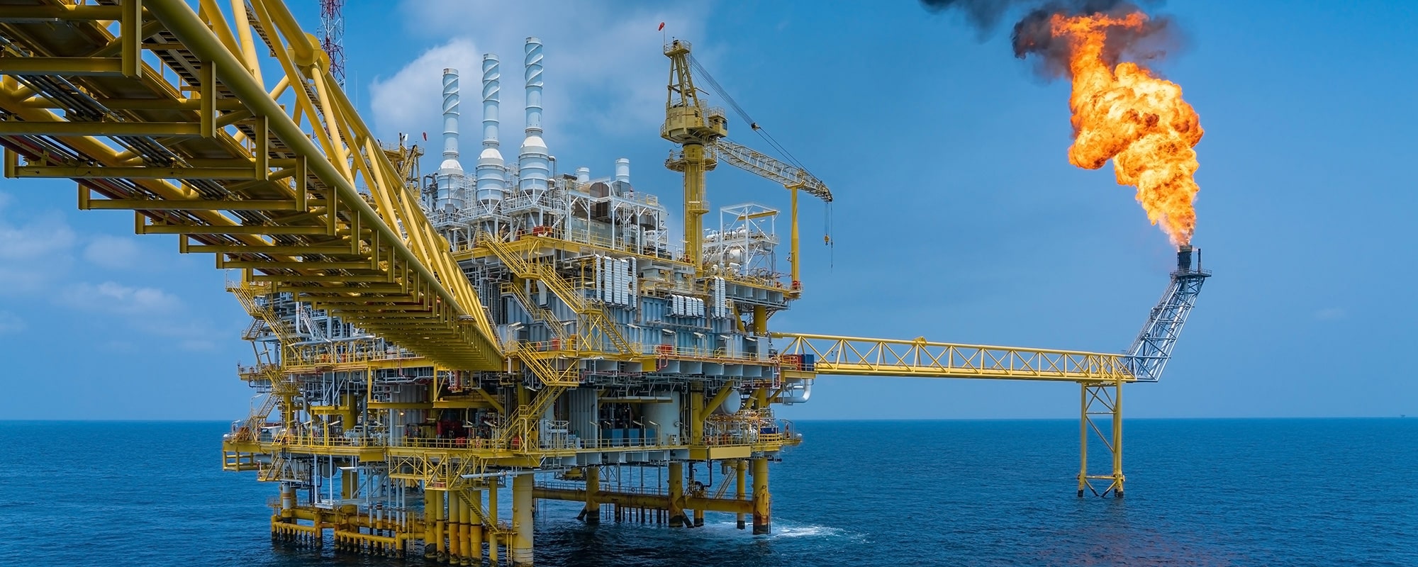 stock photo-offshore-oil-and-gas-construction-platform-while-vent-gases-to-flare-platform-to-prevent-over-1085365172